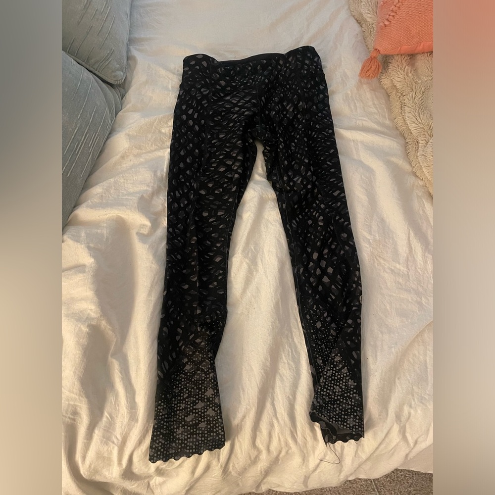 Black and gray cheetah print reflective Lululemon leggings.